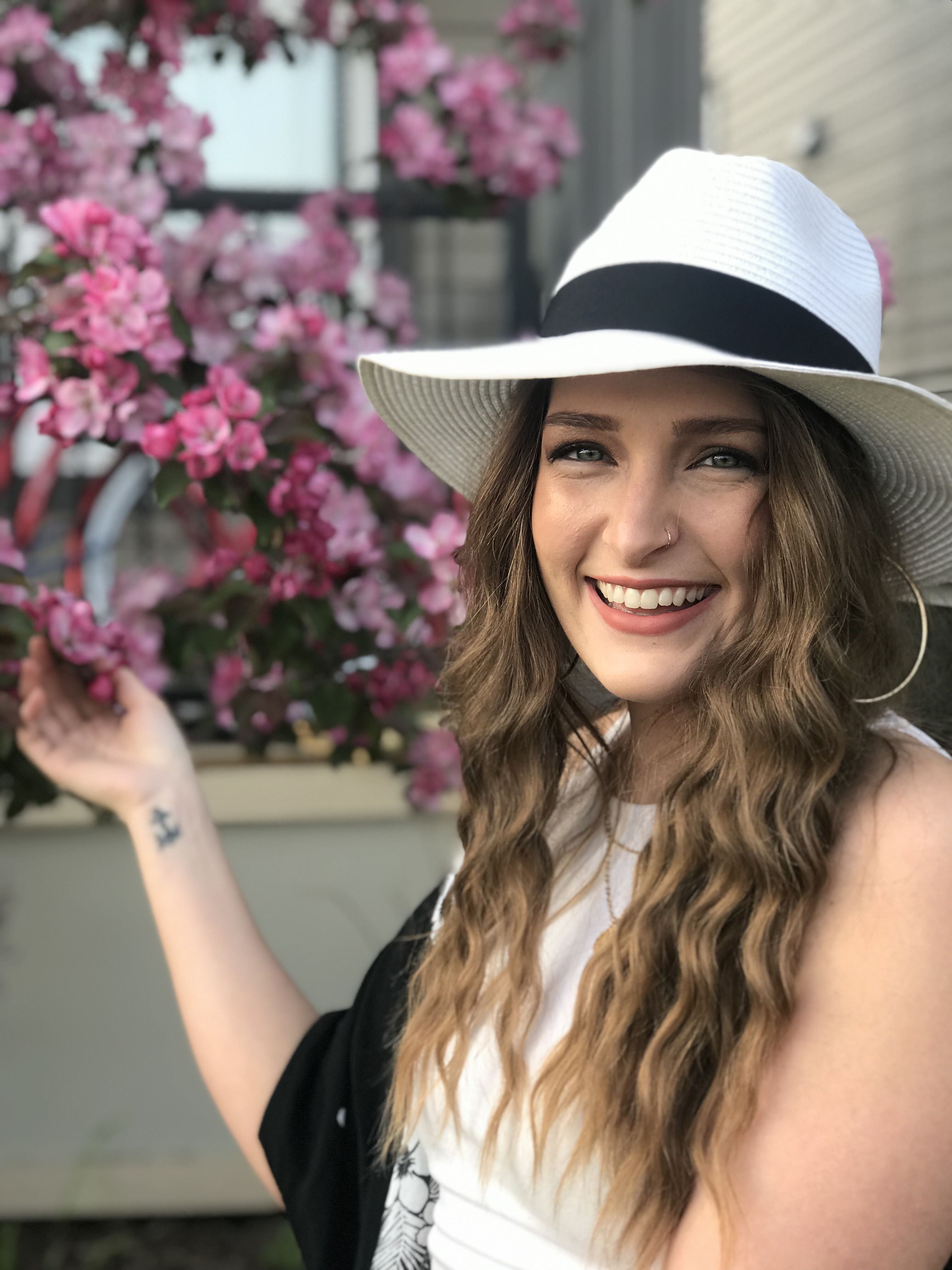 Janelle Alise smiling outdoors